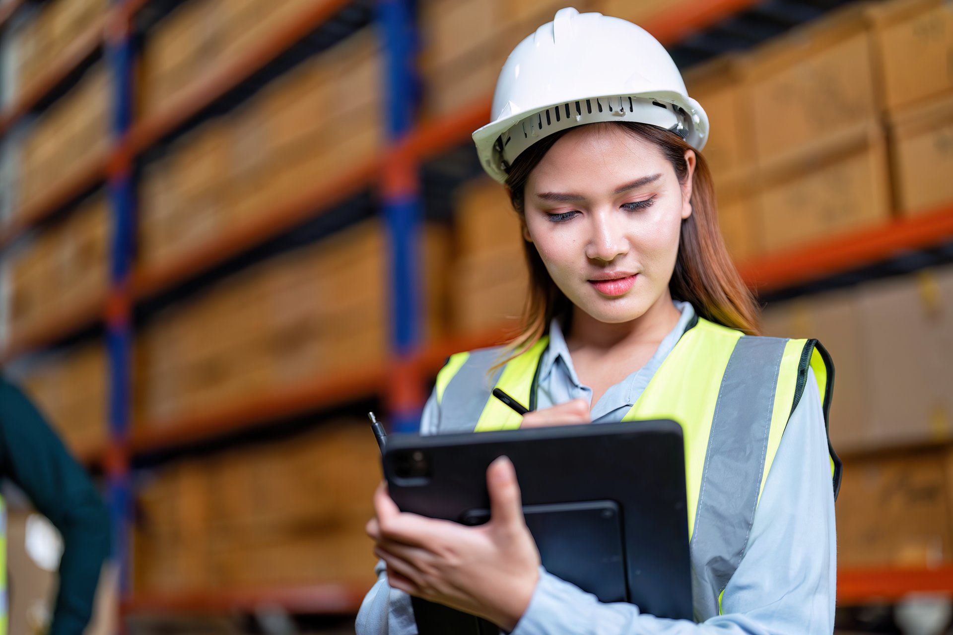 worker-in-warehouse-holding-check-list-tablet-pc-s-2023-11-27-05-19-10-utc-1