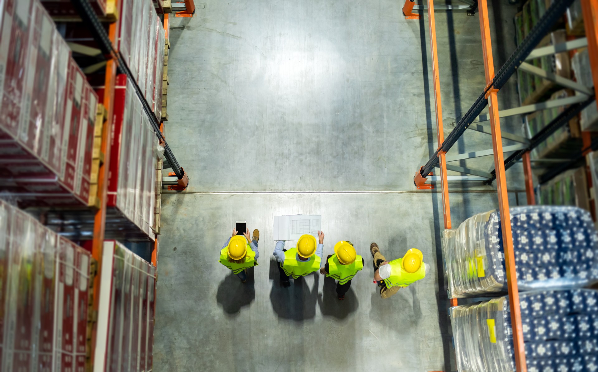 warehouse-workers-checking-delivery-plans-walking-2026-01-05-23-13-32-utc