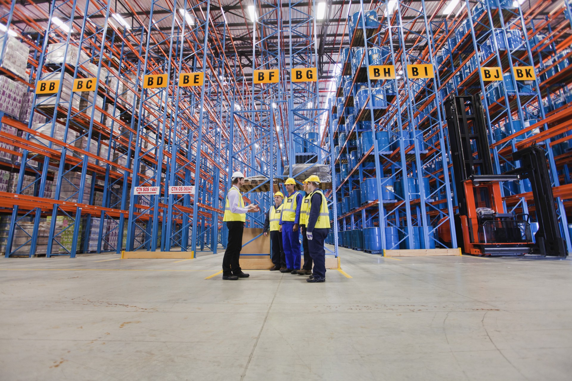 workers-talking-in-warehouse-2024-10-19-21-54-44-utc