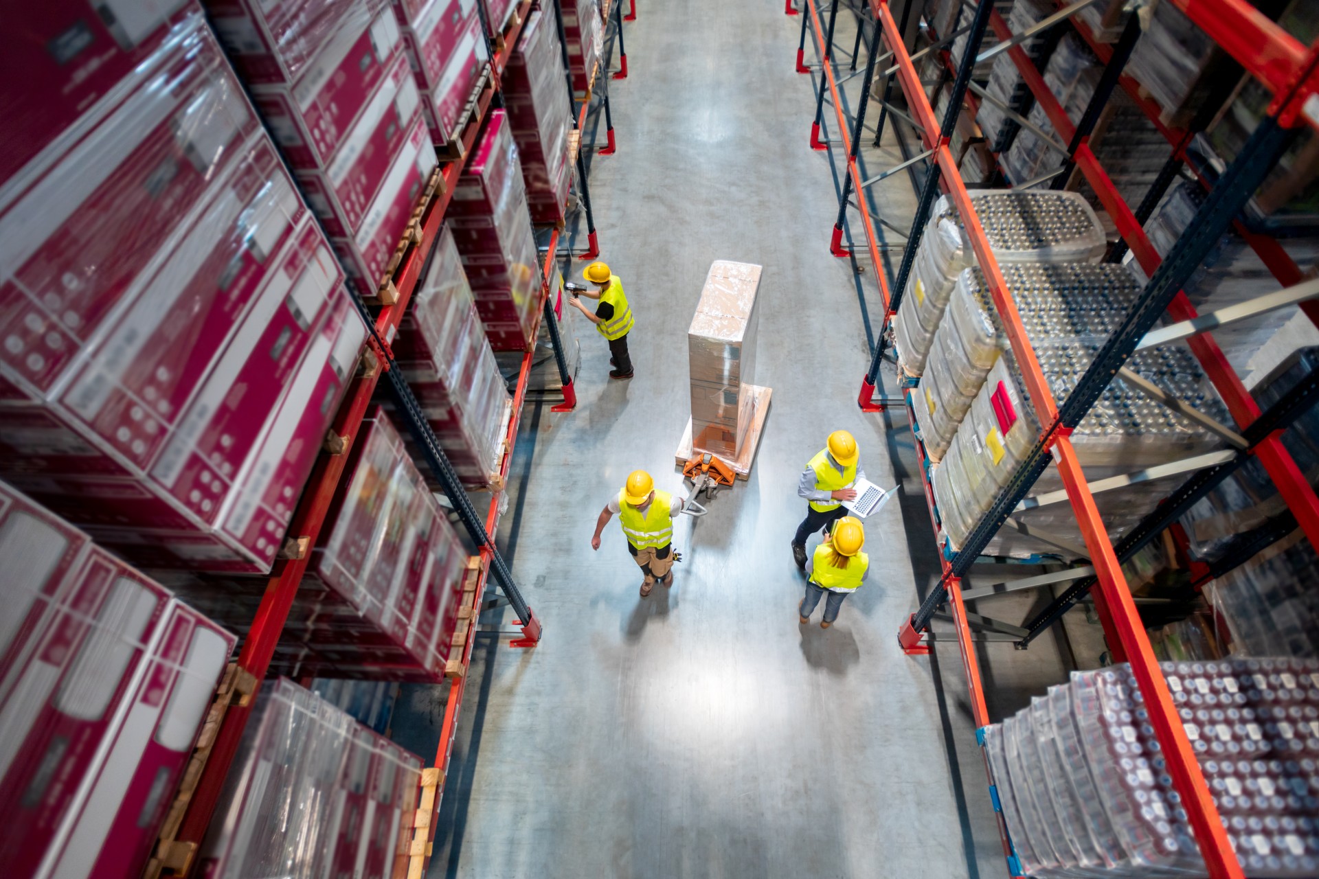 warehouse-workers-at-work-between-rows-of-tall-she-2026-03-10-22-28-51-utc